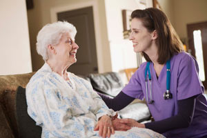 A nursing student working with a resident